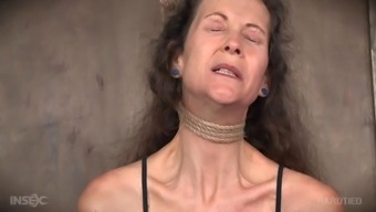 Mature BDSM submissive enjoys the pain of being tied up