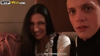 Sexy smiling brunette is fucking with two dicks