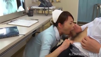 A beautiful Japanese nurse gives a blowjob to a doctor