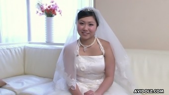 Just ordinary cute Japanese bride Emi Koizumi posing in wedding dress