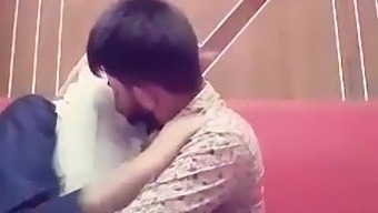 Bangladeshi girlfriend and boyfriend smooching in a restaurant
